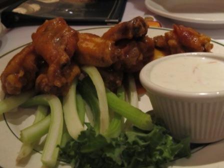 American Buffalo wings with celery ribs and blue cheese dressing served in a Hong Kong American restaurant