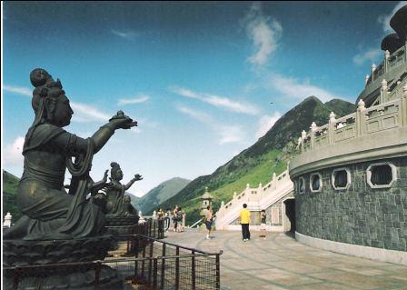There are several statues surrounding the Hong Kong Giant Buddha. Each of them has a different gesture and different stuff in their hands.