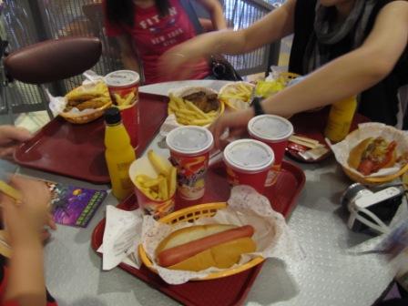 Look at this table of fast food we ordered in Hong Kong Disneyland.  Hot dogs, fries, wings and soda...
