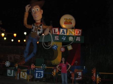My sister proudly standing in front of Sheriff Woody
