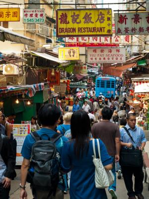 A typical Hong Kong wet market crowded with people from every walk of life and traffic....