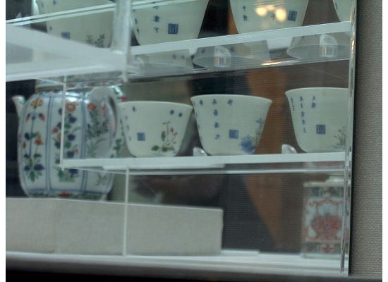 The closeup of the back of the Twelve Cups.  Can you see the stamp on each cup?  That's the name of the artist.