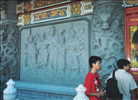 Stone craft on the wall of the Po Lin Monastery building