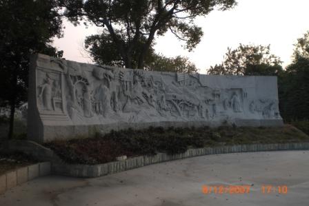Stone carving at one of the corners in the Man Tin Cheung Memorial Park